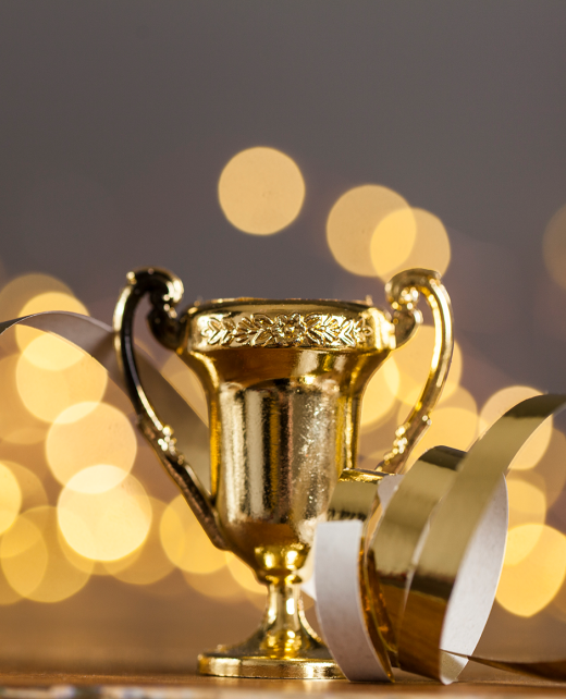gold-award-trophy-against-bright-blurred-lights-2024-09-12-00-15-17-utc-1